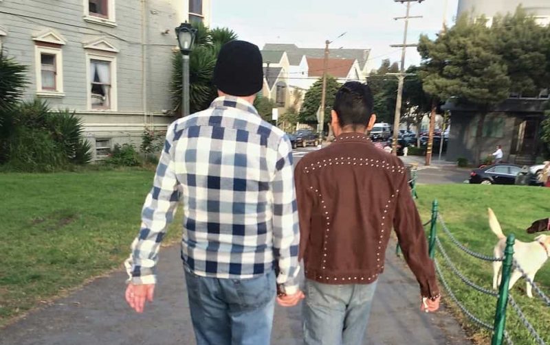 Hand in Hand Couple Walk Past Duboce Dog Park